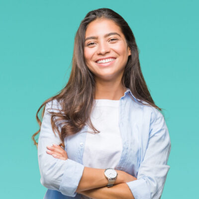 Young beautiful arab woman over isolated background happy face smiling with crossed arms looking at the camera. Positive person. Young beautiful arab woman over isolated background happy face smiling with crossed arms looking at the camera. Positive person.